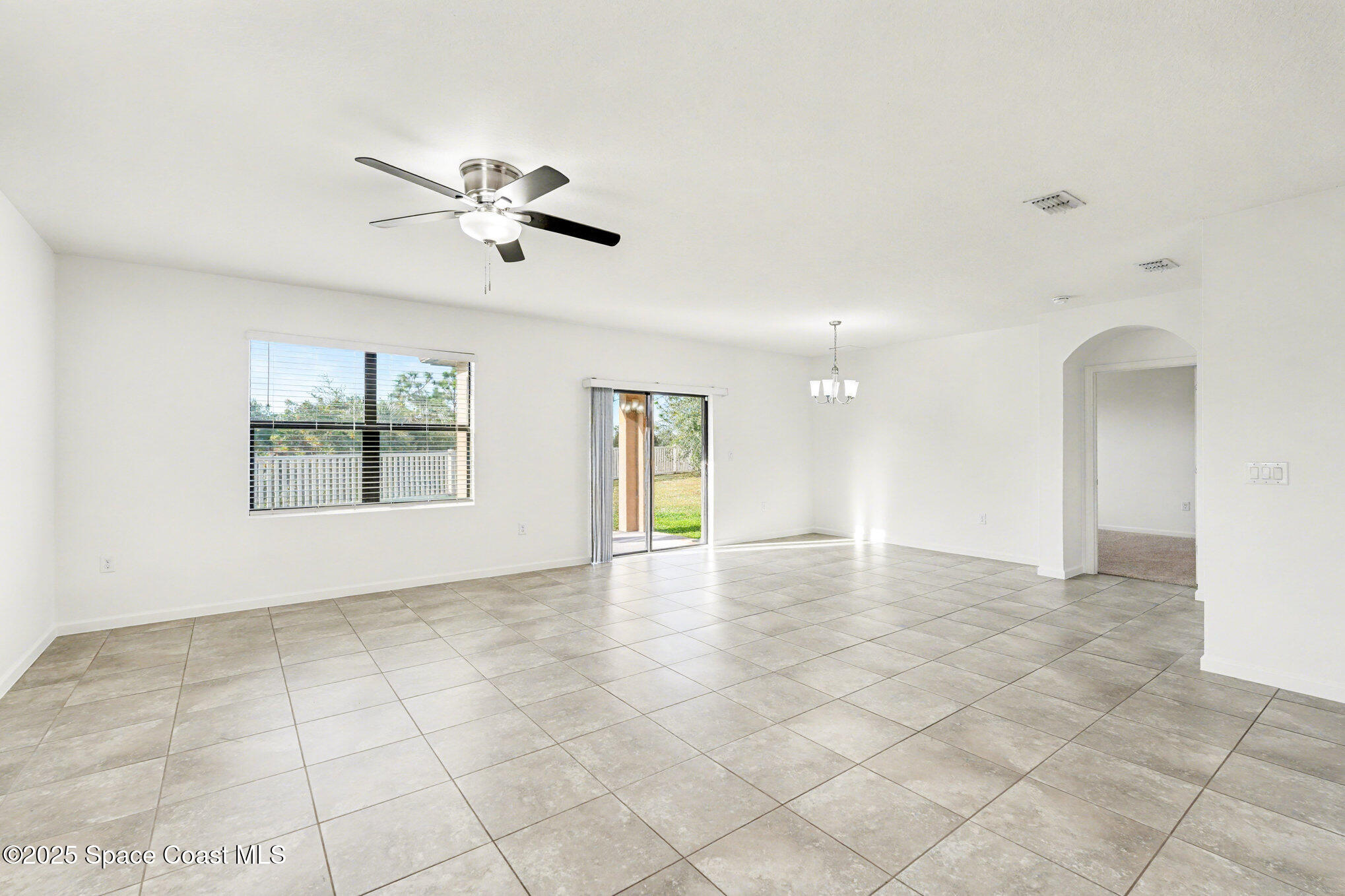 4604 Magenta Isles Drive Melbourne, FL 32904 - Photo 5 of 17 a view of an empty room with a window