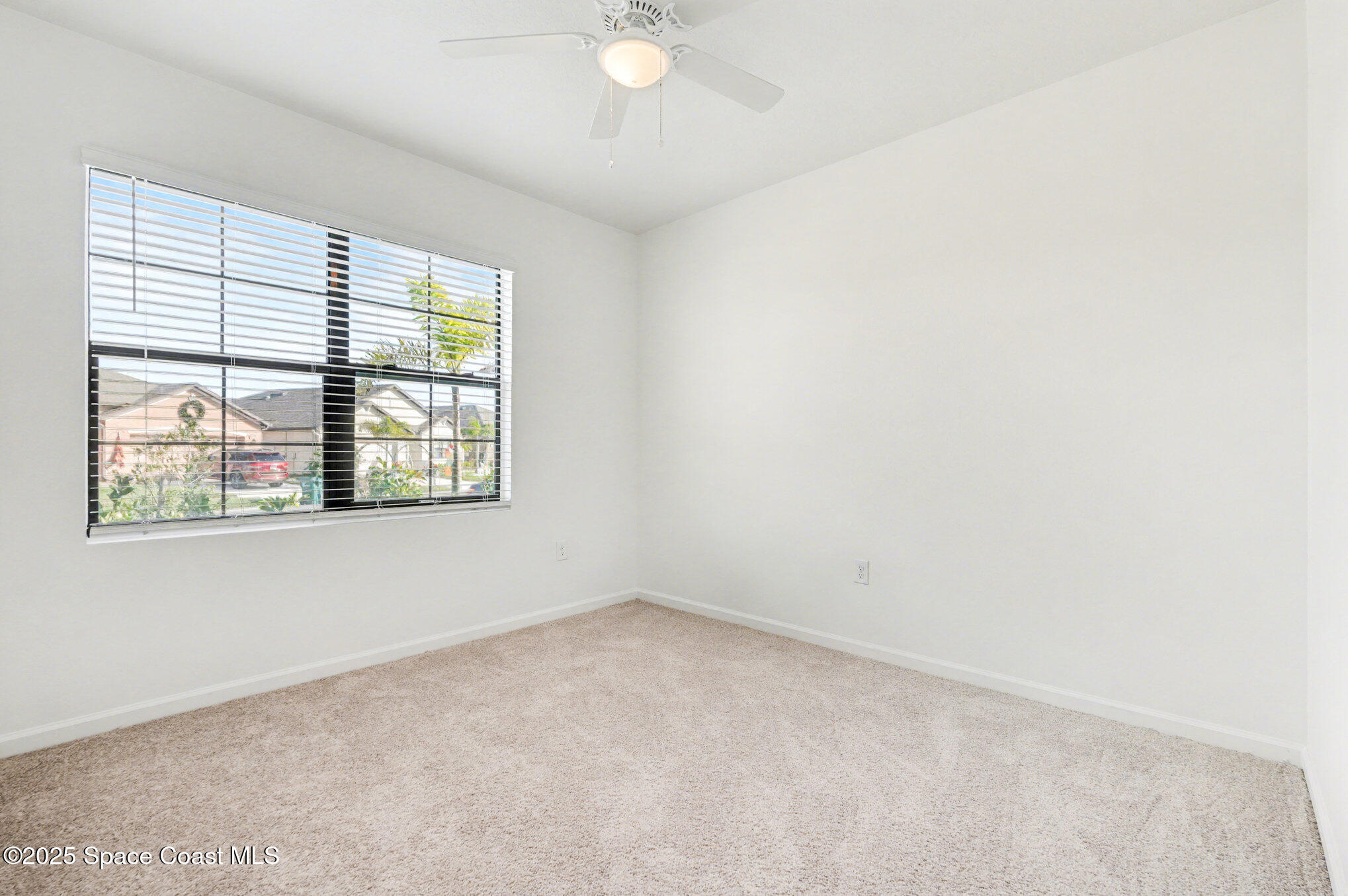 4604 Magenta Isles Drive Melbourne, FL 32904 - Photo 9 of 17 an empty room with windows