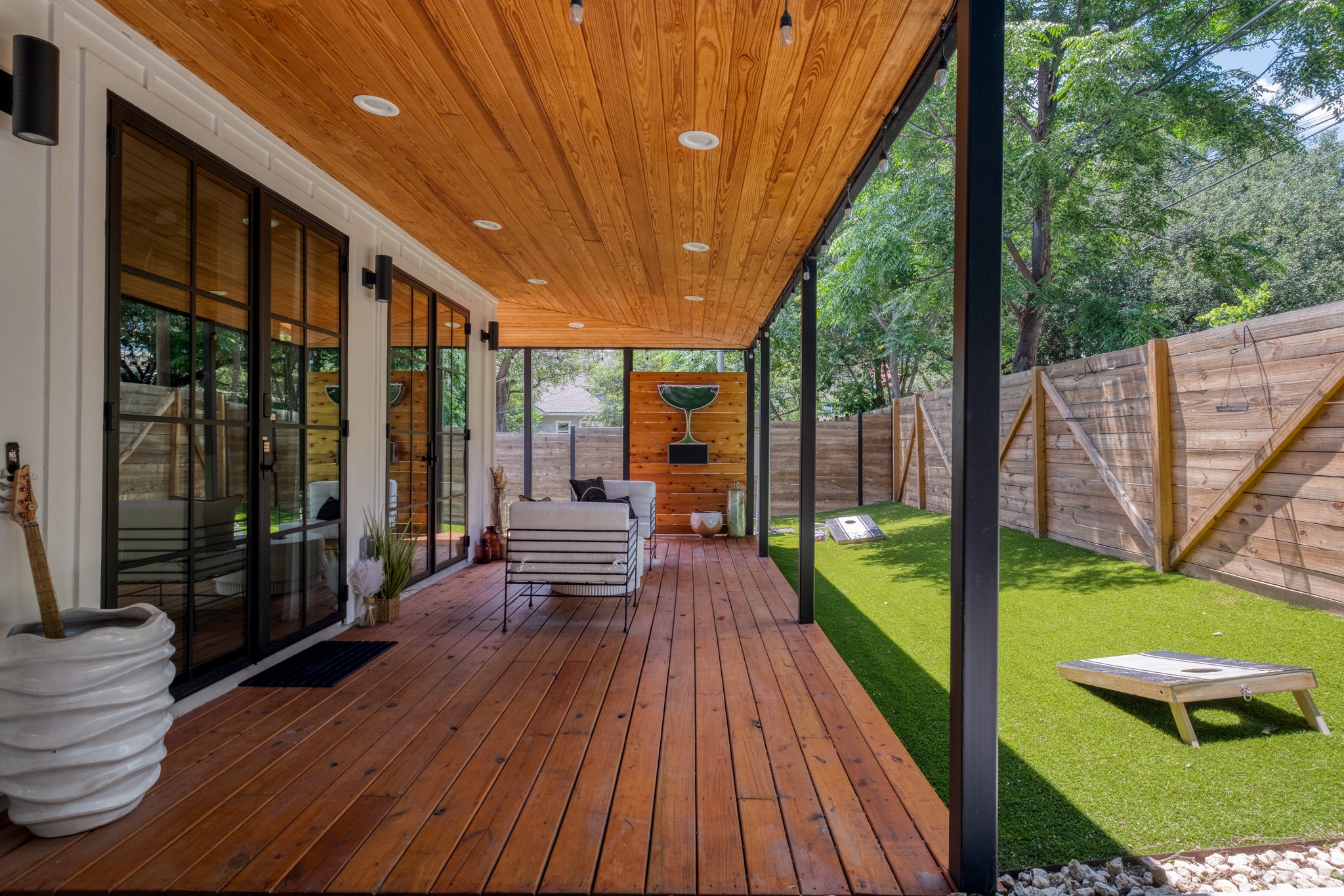 1904 East 16th Street, Unit 2 Austin, TX 78702 - Photo 2 of 20 Covered patio featuring wood-finish flooring and ceiling