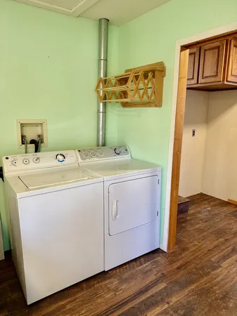 a kitchen with granite countertop a refrigerator stove and microwave