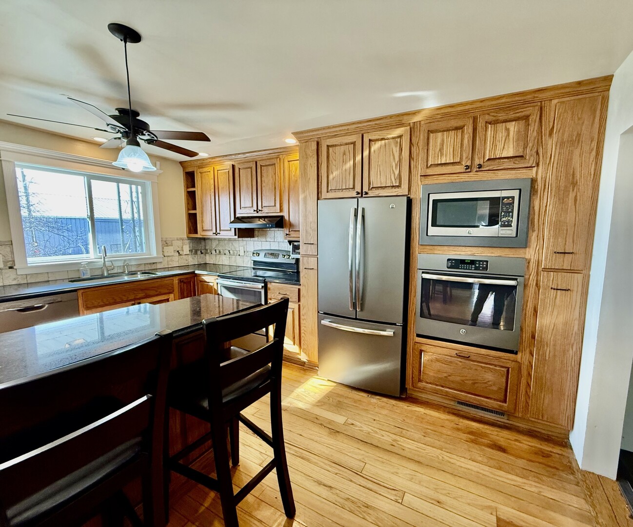 2932 Highway 17 Galva, IL 61434 - Photo 32 of 51 a kitchen with stainless steel appliances granite countertop a refrigerator a stove and a sink