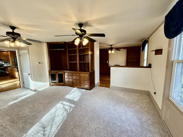 a spacious bathroom with a double vanity sink toilet and a tub