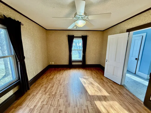 a view of entryway with wooden floor