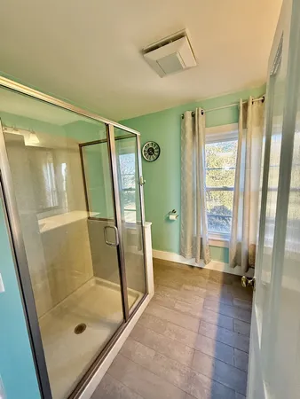 a bathroom with a sink vanity and mirror