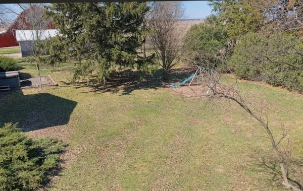 a view of a bench in the backyard