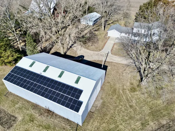 a view of a house with a yard and garage