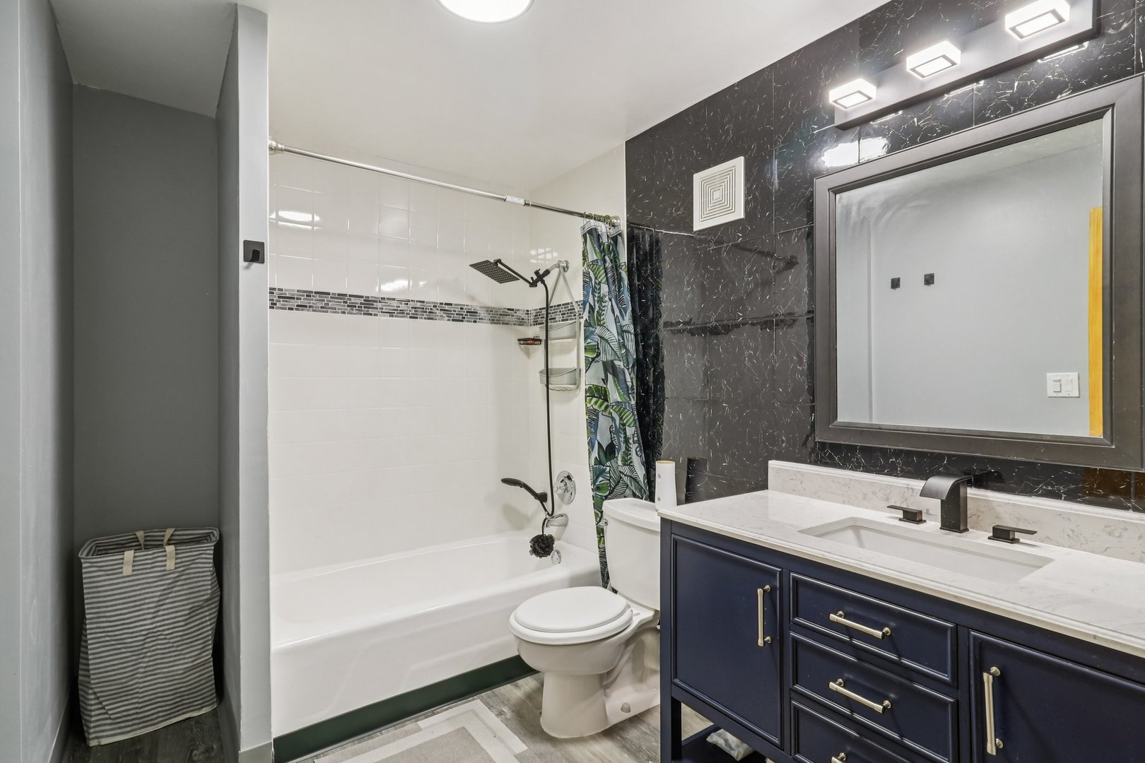 1405 East Central Road, Unit 122C Arlington Heights, IL 60005 - Photo 22 of 41 a bathroom with a double vanity sink toilet mirror and bathtub