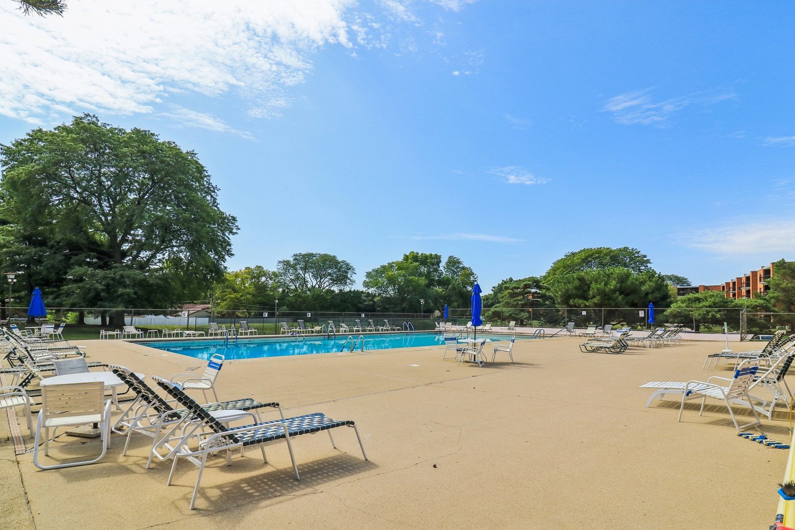 1405 East Central Road, Unit 122C Arlington Heights, IL 60005 - Photo 40 of 41 an outdoor space with swimming pool and furniture