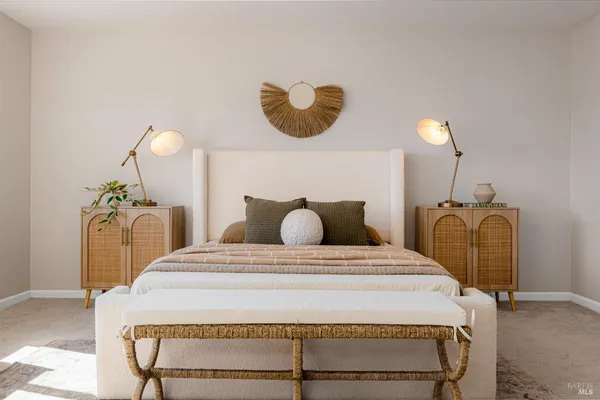 a bedroom with a bed and ceiling fan
