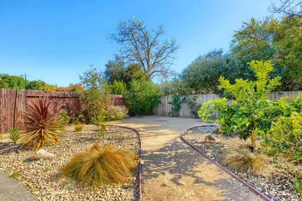 an aerial view of a houses with a swimming pool