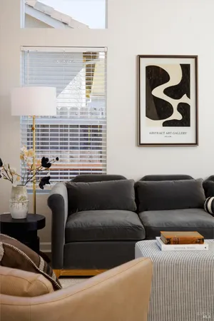 a dining room with furniture and window