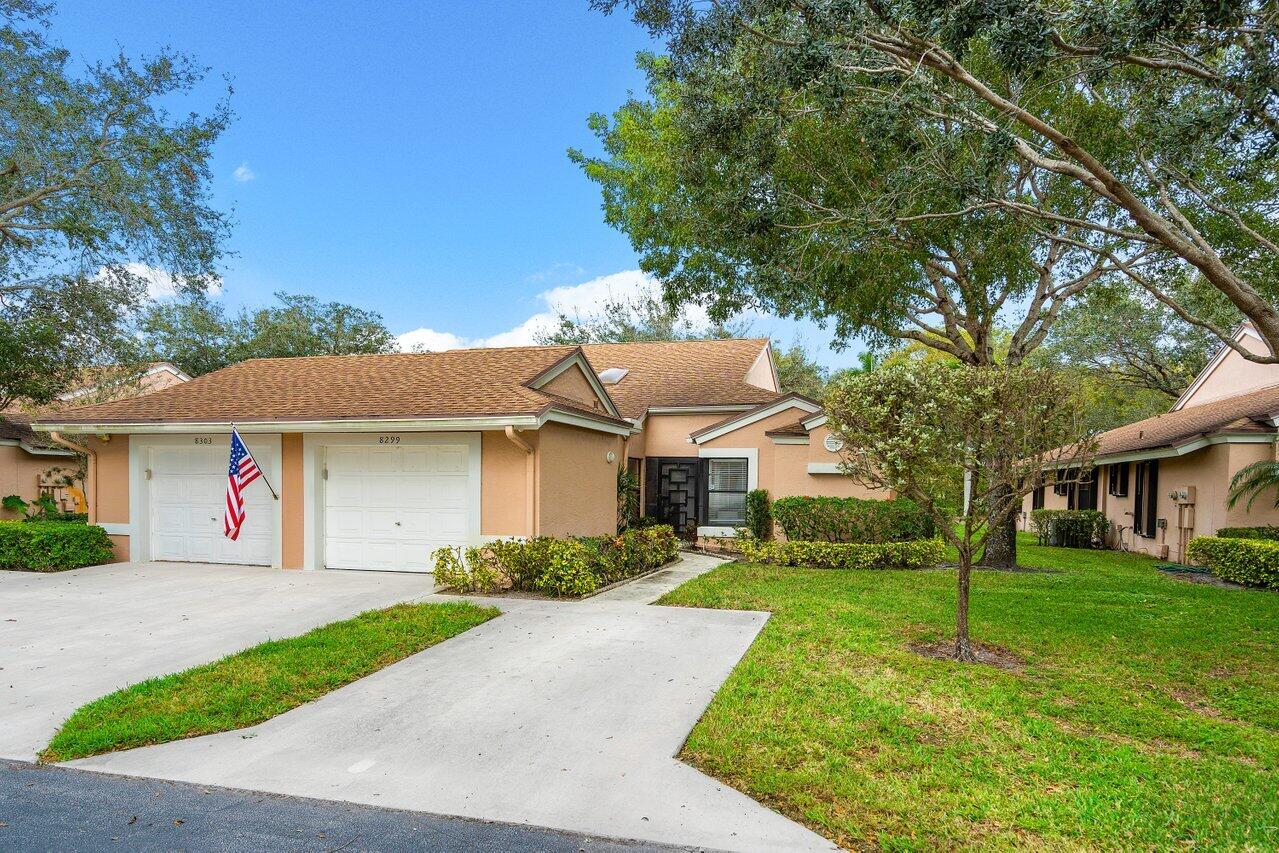 8299 Springlake Drive, Unit B Boca Raton, FL 33496 - Photo 2 of 31 a front view of house with yard and green space