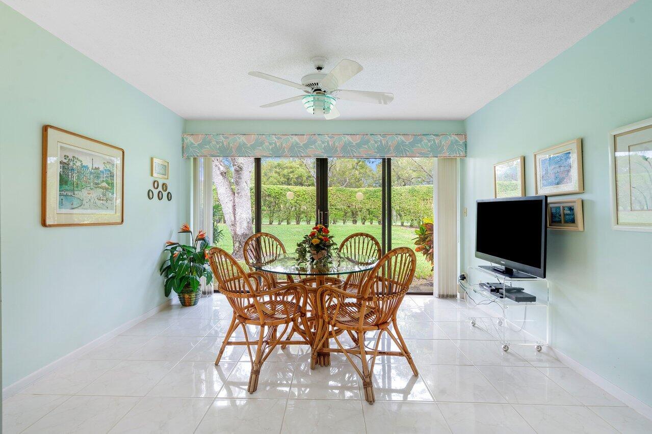 8299 Springlake Drive, Unit B Boca Raton, FL 33496 - Photo 21 of 31 a view of a livingroom with furniture window and a flat screen tv