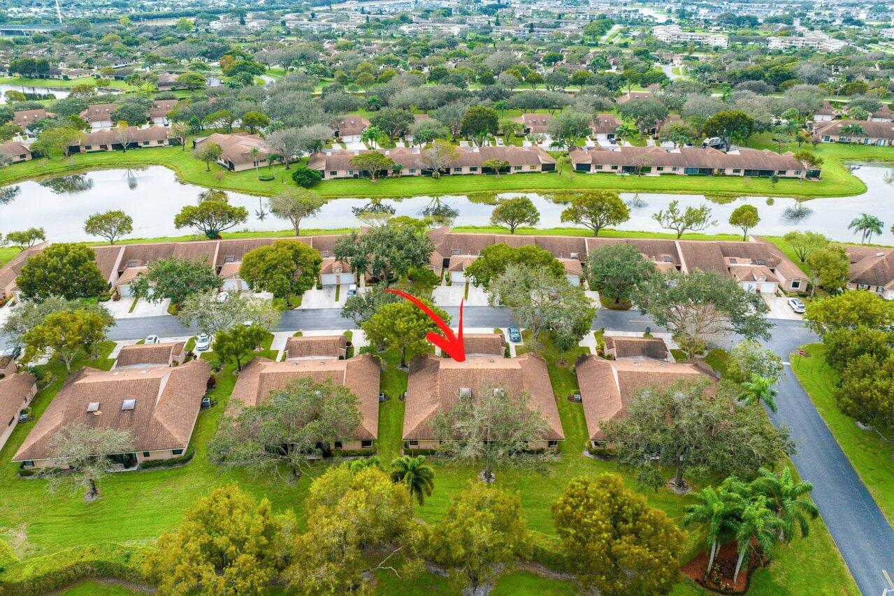 8299 Springlake Drive, Unit B Boca Raton, FL 33496 - Photo 3 of 31 an aerial view of residential houses with outdoor space and trees