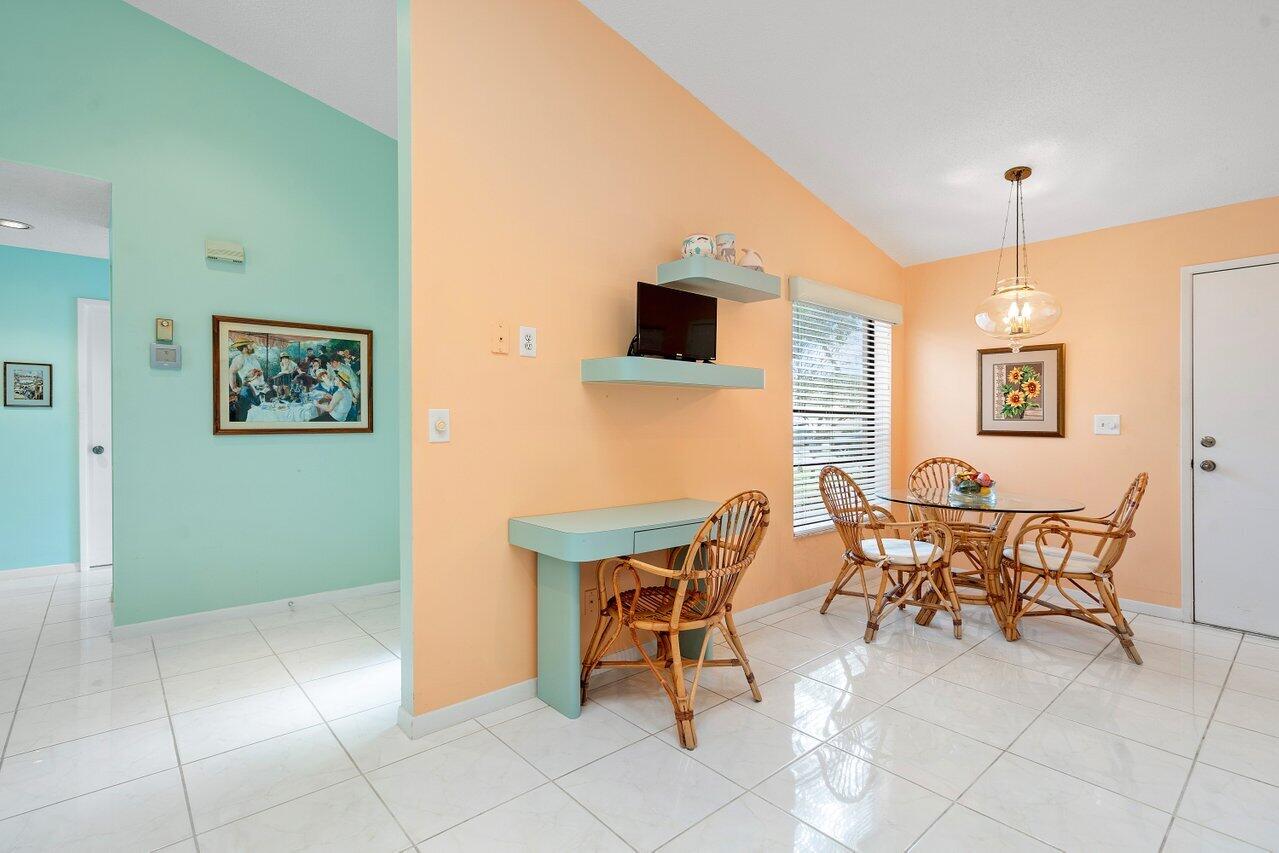 8299 Springlake Drive, Unit B Boca Raton, FL 33496 - Photo 8 of 31 a patio with table and chairs