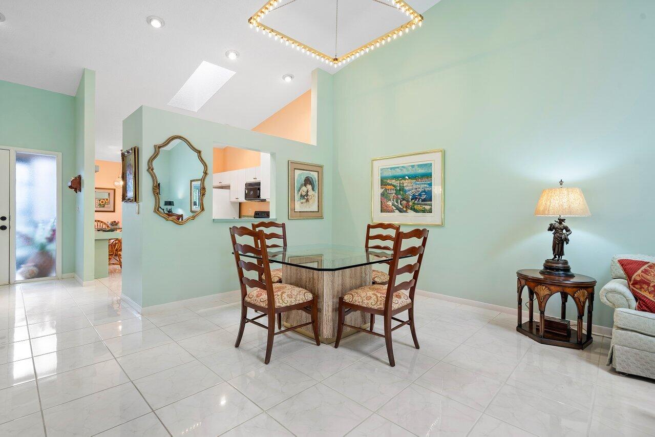 8299 Springlake Drive, Unit B Boca Raton, FL 33496 - Photo 9 of 31 a view of a dining room with furniture