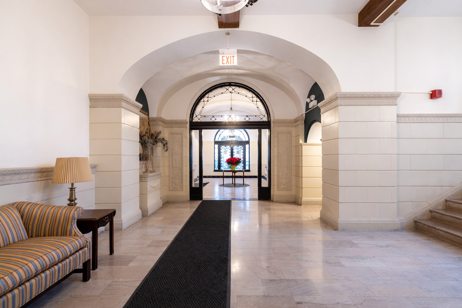 1765 East 55th Street, Unit E1 Chicago, IL 60637 - Photo 16 of 18 a living room with furniture and a large window