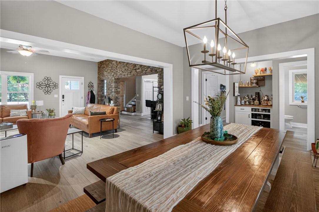 1504 Double Springs Road Townville, SC 29689 - Photo 9 of 41 This inviting interior features an open concept living and dining area with hardwood floors and a built-in bar.