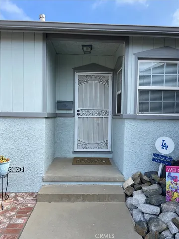 a view of a backyard with sitting area