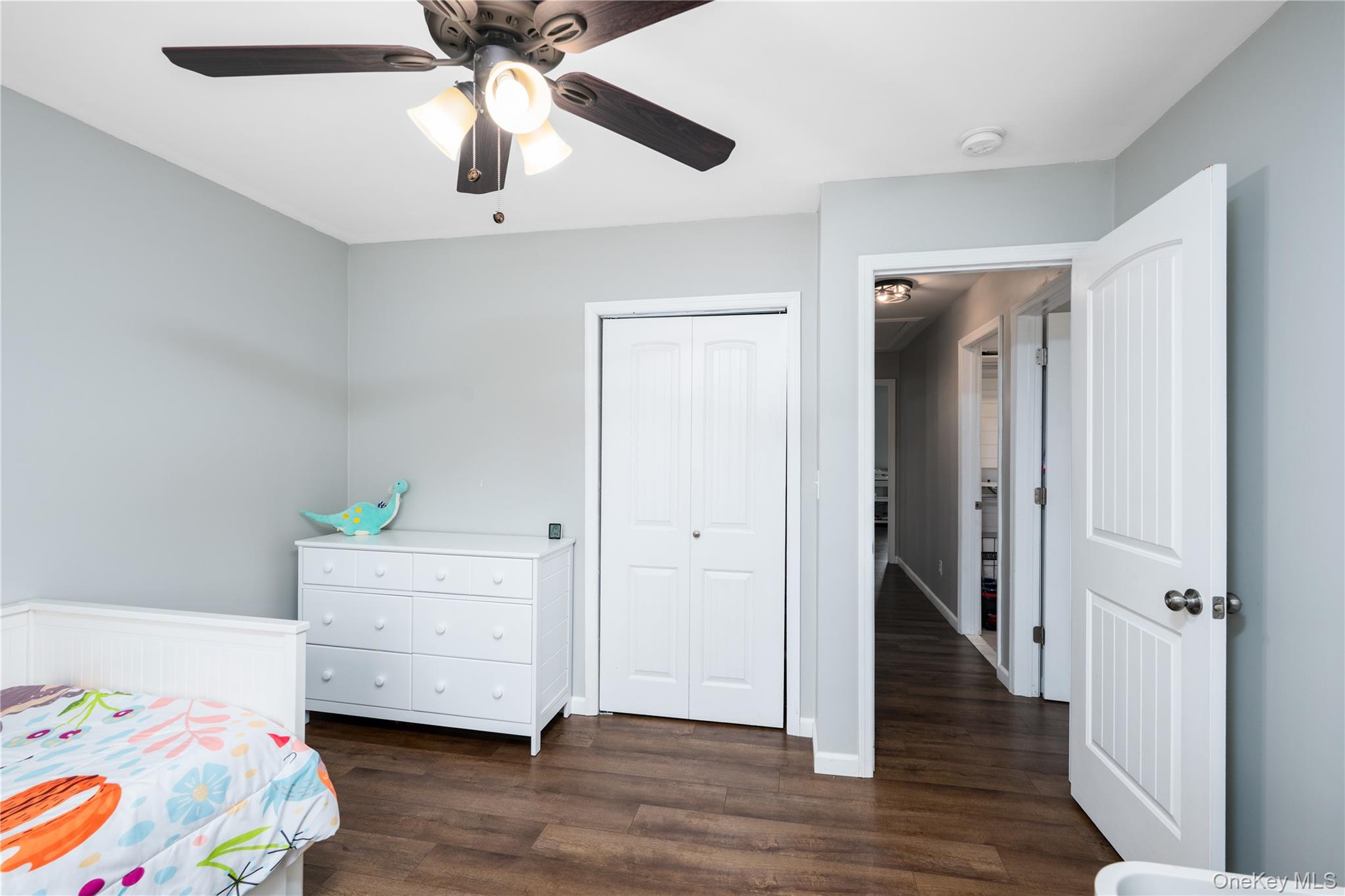 41 Diddell Road Wappingers Falls, NY 12590 - Photo 18 of 44 Bedroom 1-featuring wood-flooring, light gray wall paint, and a ceiling fan with integrated lighting