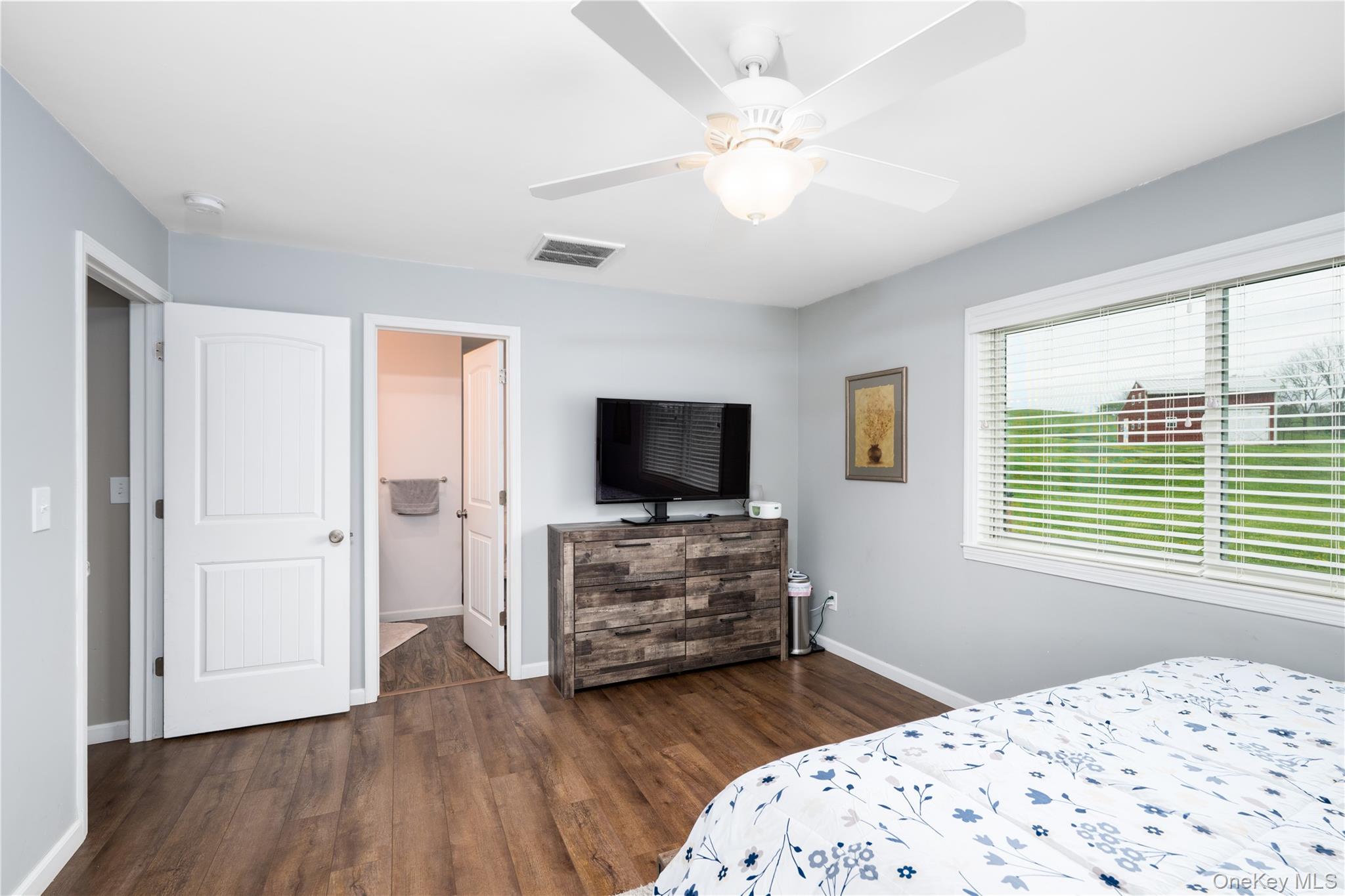 41 Diddell Road Wappingers Falls, NY 12590 - Photo 23 of 44 Spacious room featuring wood-flooring, a ceiling fan with light fixture, and a large window with blinds