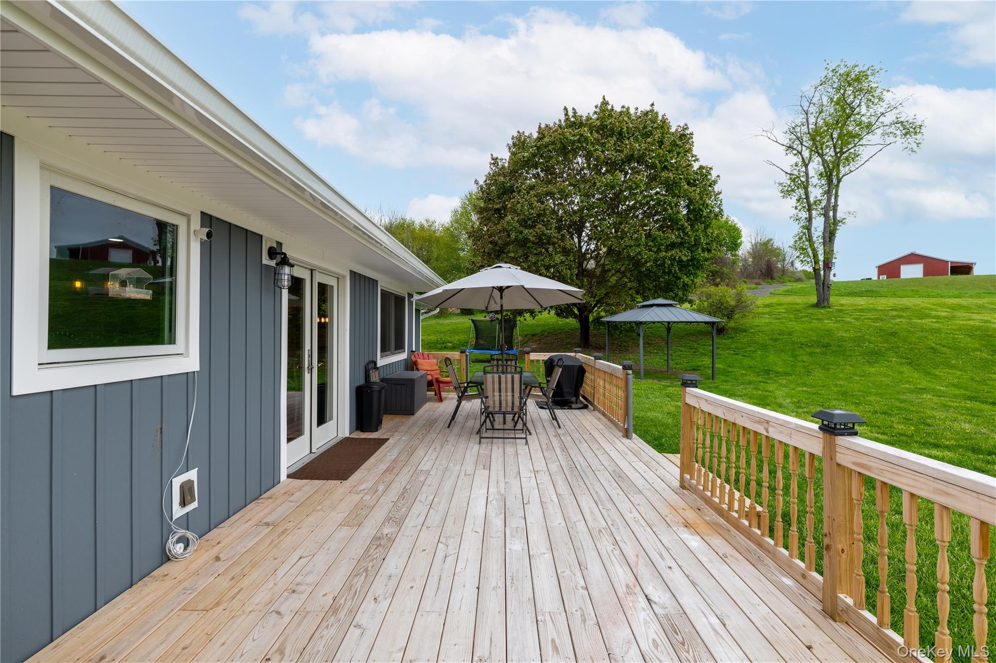 41 Diddell Road Wappingers Falls, NY 12590 - Photo 4 of 44 Spacious wooden deck with natural wood railing and integrated post cap lighting