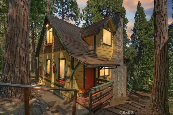 a view of a house with a tree