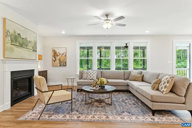 a spacious bedroom with a bed and a lamp