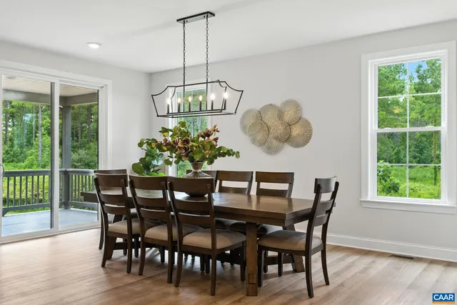 a bedroom with a bed couches and a window