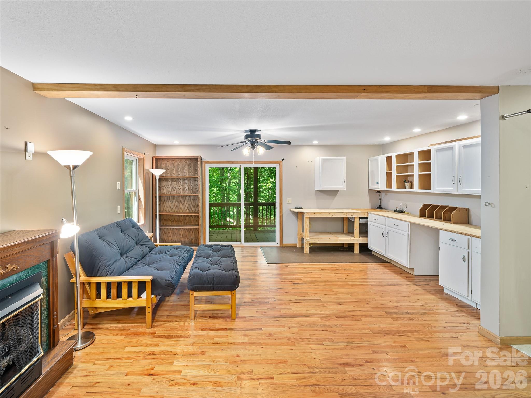 142 Wildflower Road Spruce Pine, NC 28777 - Photo 23 of 46 a living room with furniture a large window with kitchen view