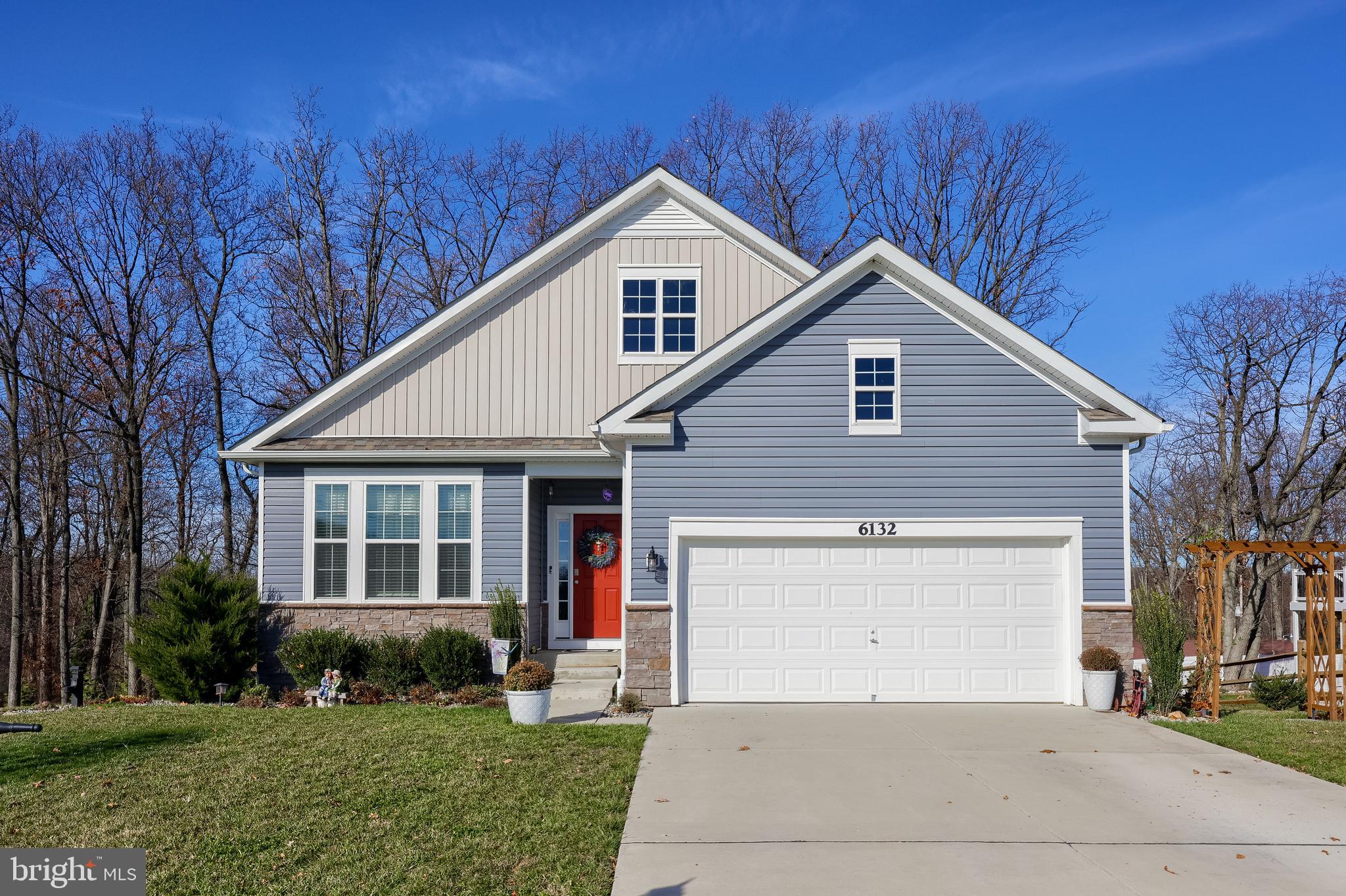 6132 Deborah Drive Spring Grove, PA 17362 - Photo 1 of 33 a front view of a house with a yard and garage