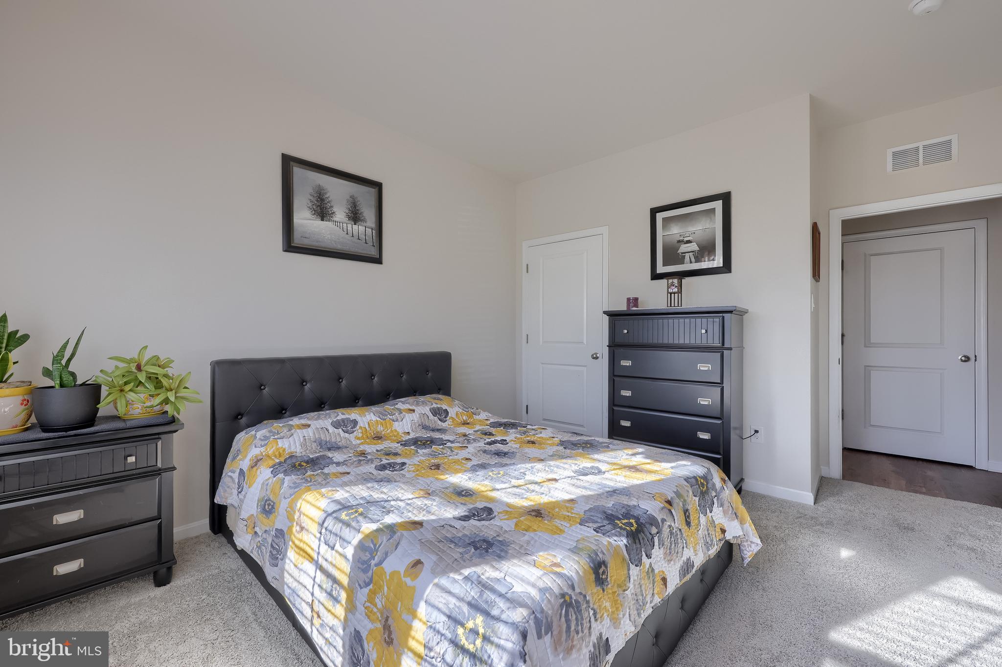 6132 Deborah Drive Spring Grove, PA 17362 - Photo 17 of 33 a bedroom with a bed and a potted plant