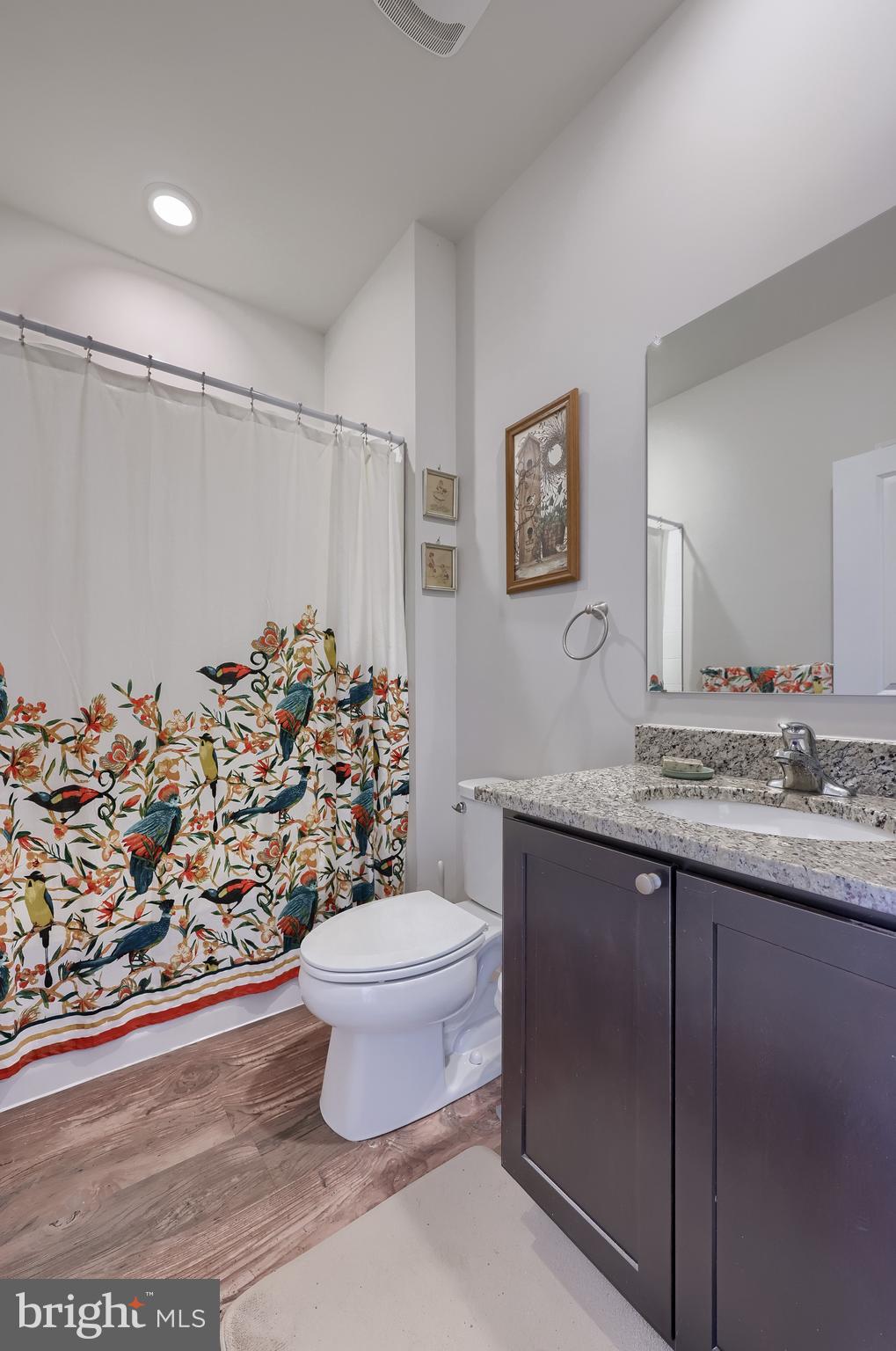 6132 Deborah Drive Spring Grove, PA 17362 - Photo 18 of 33 a bathroom with a granite countertop sink a toilet and a shower