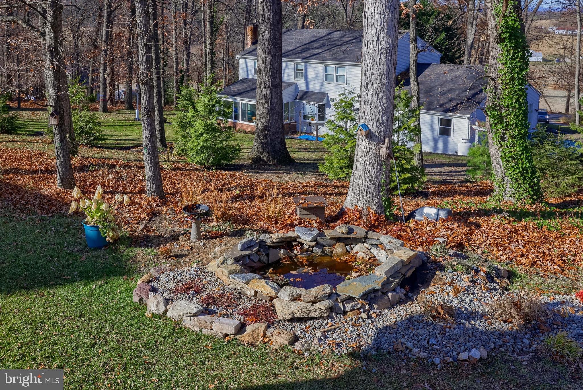 6132 Deborah Drive Spring Grove, PA 17362 - Photo 25 of 33 a view of a house with a garden and trees