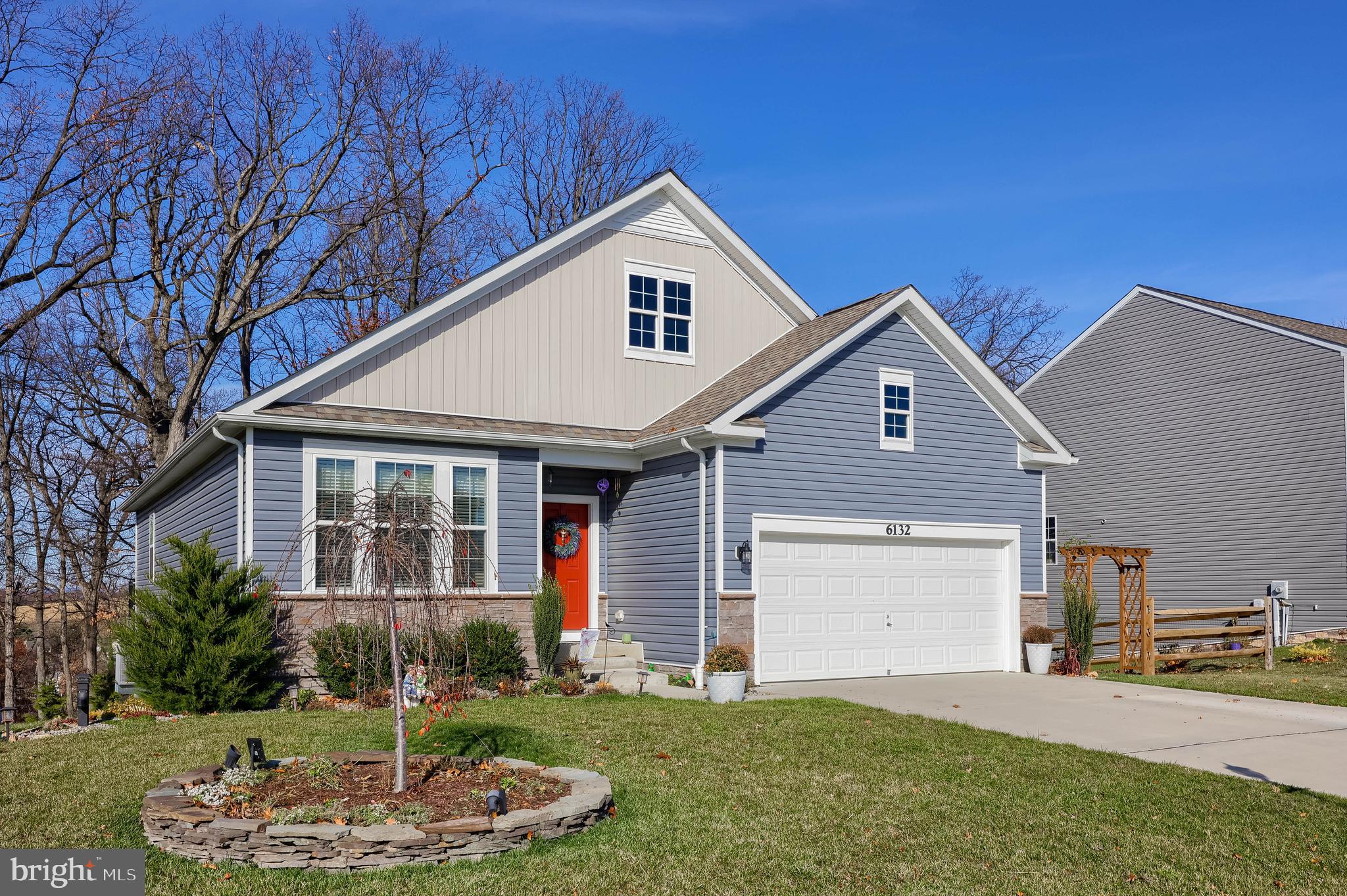 6132 Deborah Drive Spring Grove, PA 17362 - Photo 30 of 33 a front view of a house with a yard and garage