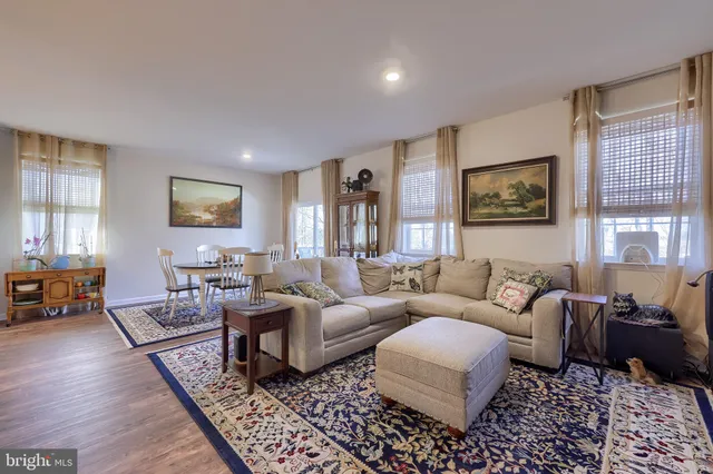 a living room with furniture or couch and a window