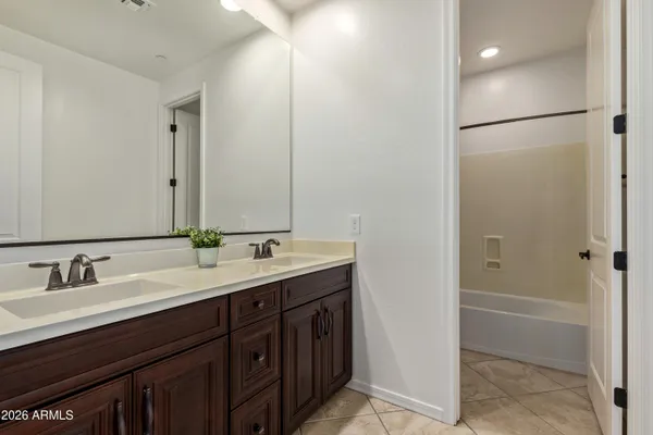 a view of an empty room with a ceiling fan
