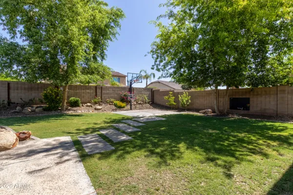 a view of a backyard with furniture