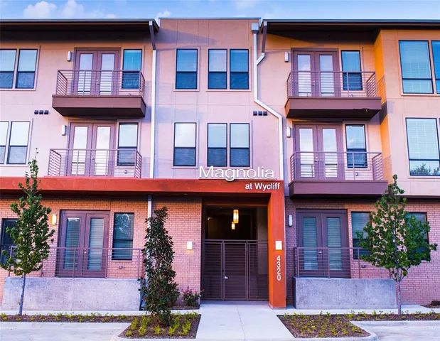 a front view of a multi story residential apartment building