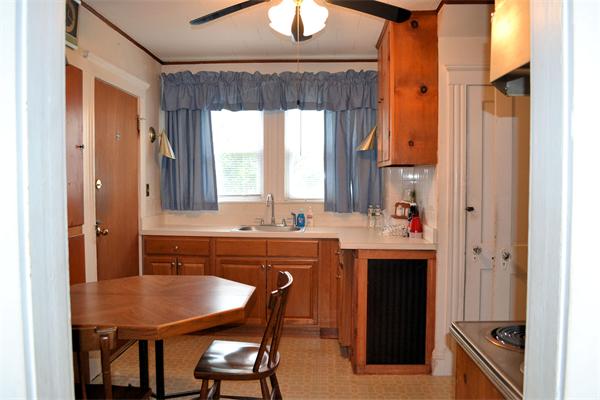 11 Sunset Road Cambridge, MA 02138 - Photo 11 of 18 a kitchen with a table chairs and a window