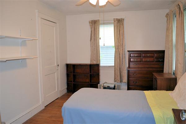 11 Sunset Road Cambridge, MA 02138 - Photo 16 of 18 a bedroom with a bed and furniture