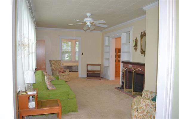 11 Sunset Road Cambridge, MA 02138 - Photo 7 of 18 a living room with furniture and a fireplace