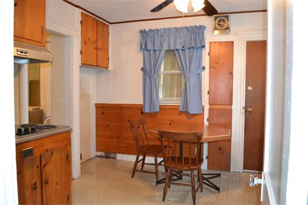 11 Sunset Road Cambridge, MA 02138 - Photo 10 of 18 a dining room filled with furniture and a window