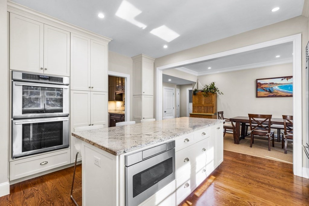 36 Newbrook Circle Newton, MA 02467 - Photo 12 of 29 a view of kitchen island wooden floor and electronic appliances