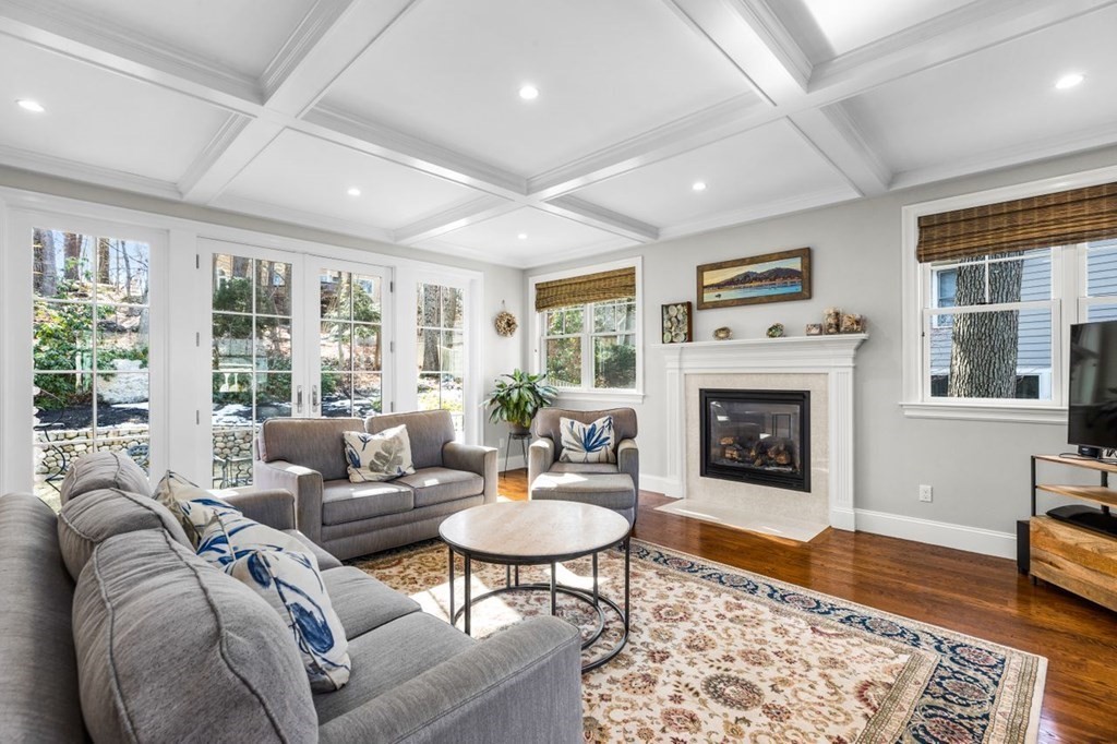 36 Newbrook Circle Newton, MA 02467 - Photo 13 of 29 a living room with furniture and a fireplace