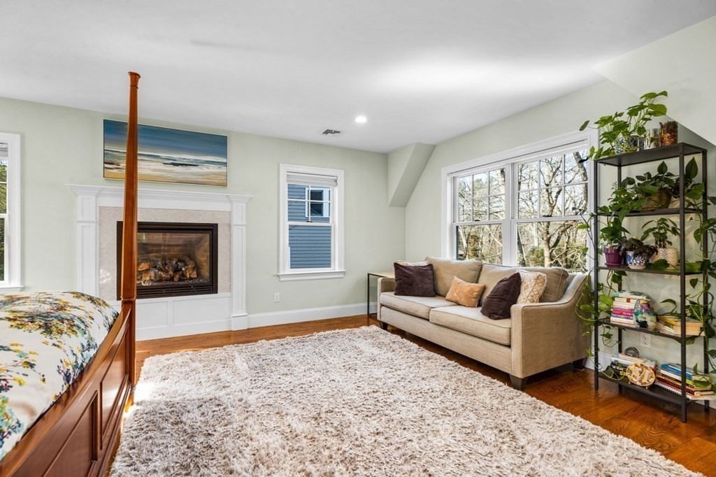 36 Newbrook Circle Newton, MA 02467 - Photo 19 of 29 a living room with furniture window and a fireplace