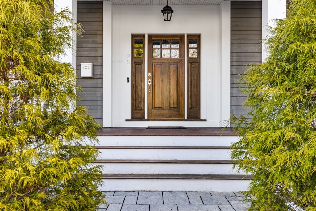 36 Newbrook Circle Newton, MA 02467 - Photo 2 of 29 a front view of a house with a yard and plants