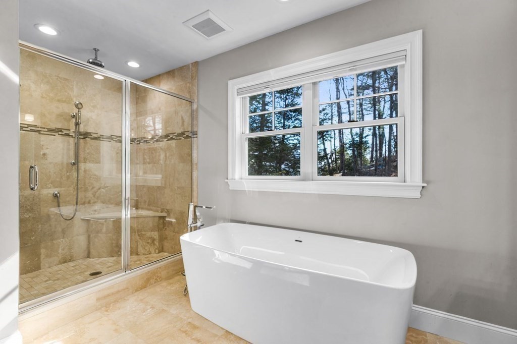 36 Newbrook Circle Newton, MA 02467 - Photo 21 of 29 a bathroom with a bathtub and shower