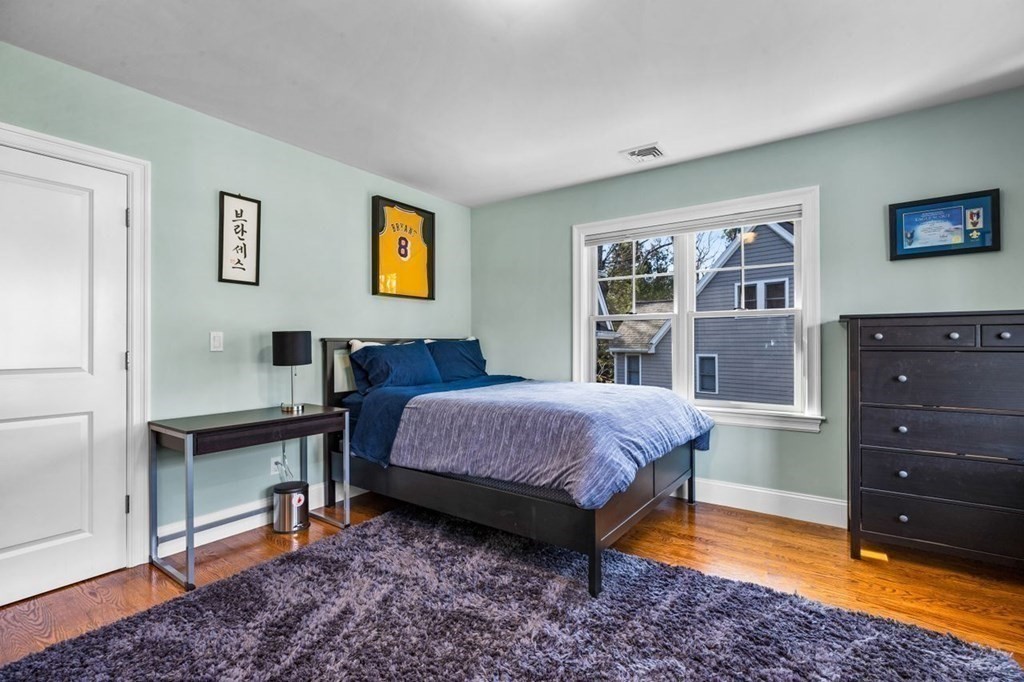 36 Newbrook Circle Newton, MA 02467 - Photo 24 of 29 a bedroom with a bed and a dresser