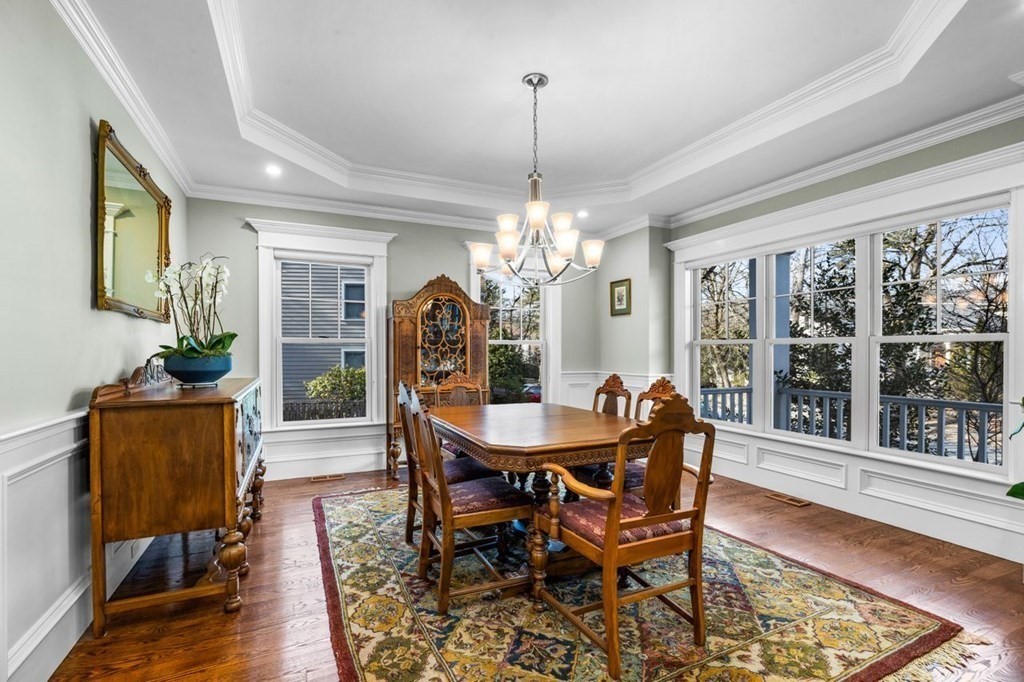 36 Newbrook Circle Newton, MA 02467 - Photo 6 of 29 a dining room with furniture a chandelier and wooden floor